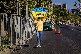 Ukrainian citizens in Chile protest outside the Russian Embassy